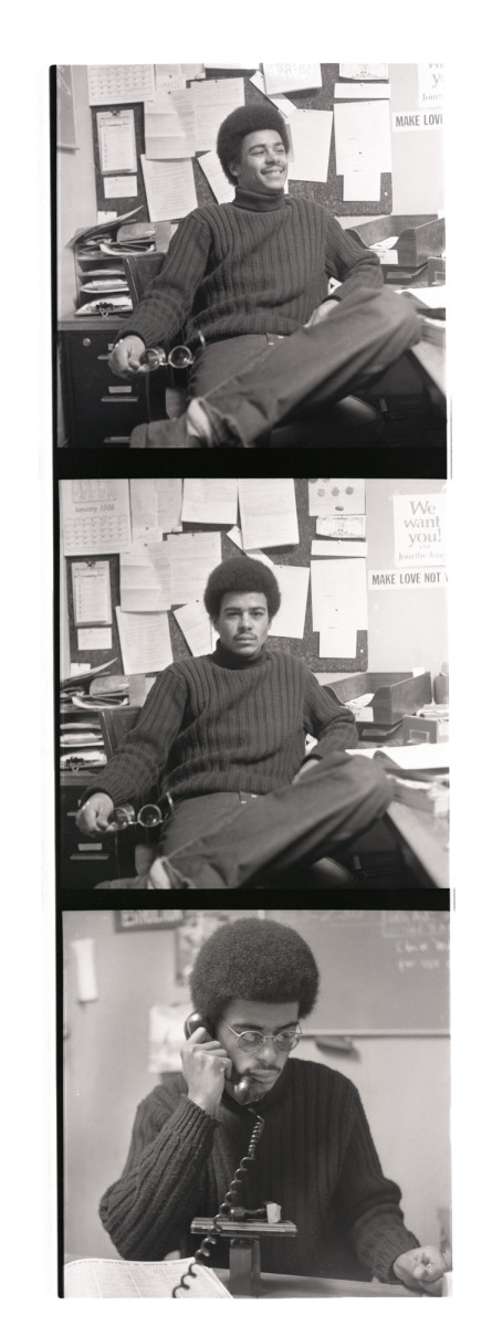 Posing in the office with a phone (Swarthmore College Peace Collection)