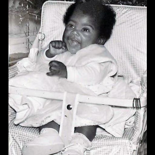 baby photo of Linda Thurston with fist raised (photo courtesy of the Thurston family)