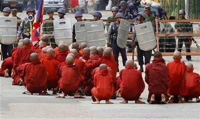 Monks sitting in the road at protest