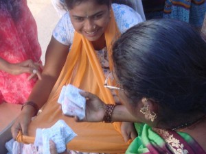 Sex workers who work with SANGRAM distribute condoms in Sangli’s red light district. Photo courtesy of  International Women’s Health Coalition.