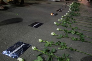 Flowers laid on the ground at Women in Black protest of the Srebrenica Genocide.  Photo: Biljana Rakocevic