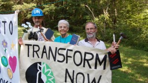 Sister Megan, Greg Boertje-Obed, and Michael Walli with Transform Now banner