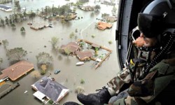 Military Helicopter Pilot overlooks flooded town