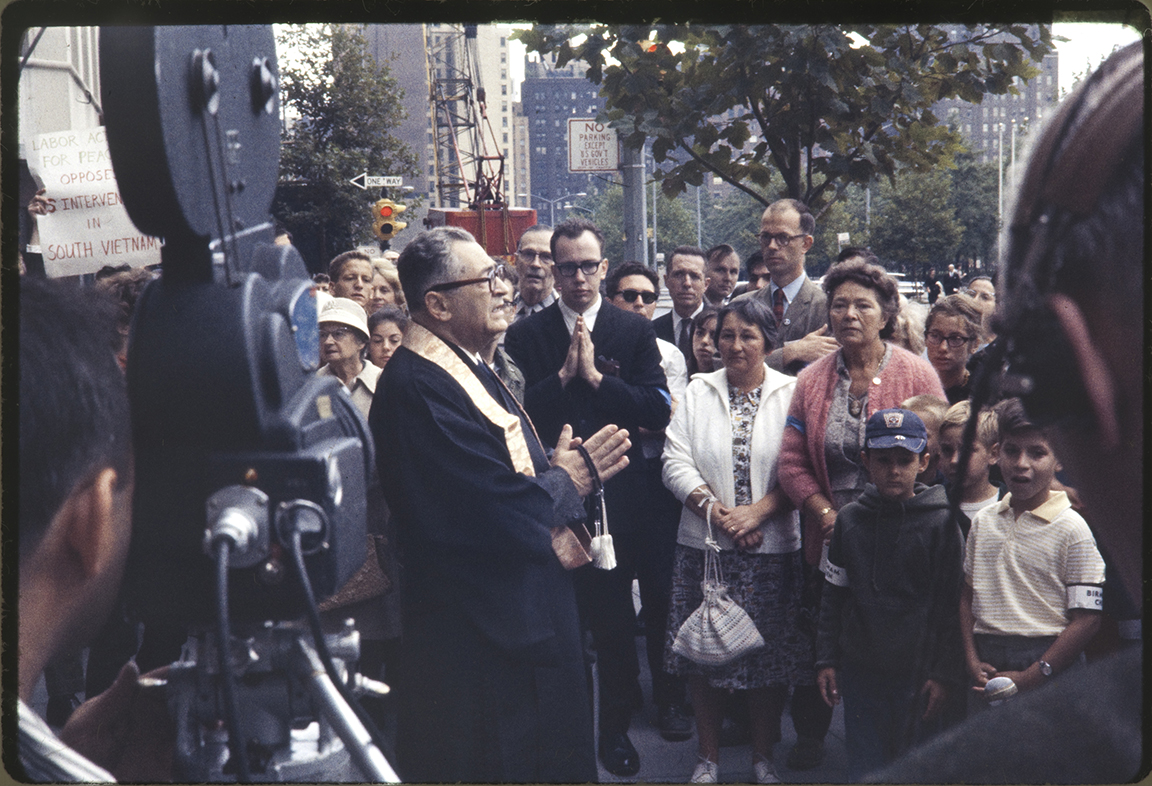 Rev. Donald Harrington speaking to demonstrators at the U.S. Mission as WRL staff members Jim Peck and David McReynolds (center rear) looked on. Photo courtesy of David McReynolds.
